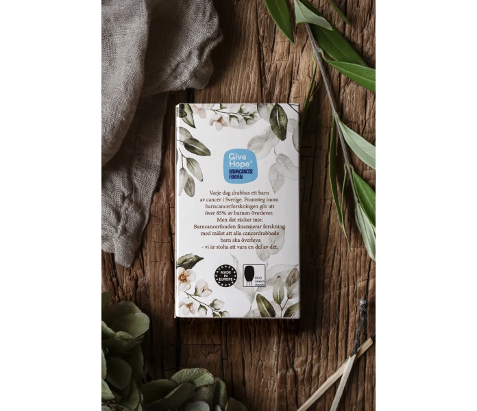 tandsticksask barncancerfonden baksida majas cottage kuva