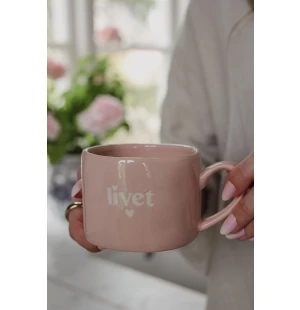 Muki tekstillä kuva