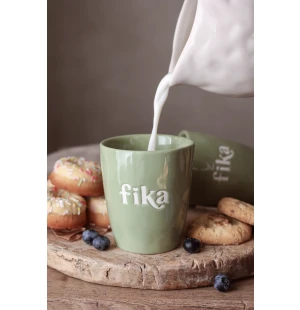 Muki tekstillä kuva