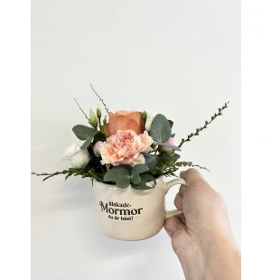 Muki kukka-asetelmalla kuva