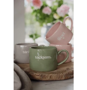 Muki tekstillä kuva